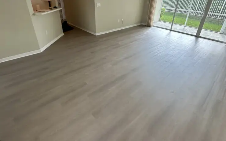Dark walnut laminate flooring installation by Triangle Flooring