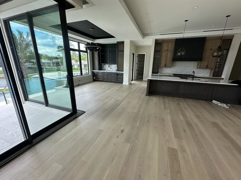 Custom herringbone hardwood flooring in luxury Lakewood Ranch home