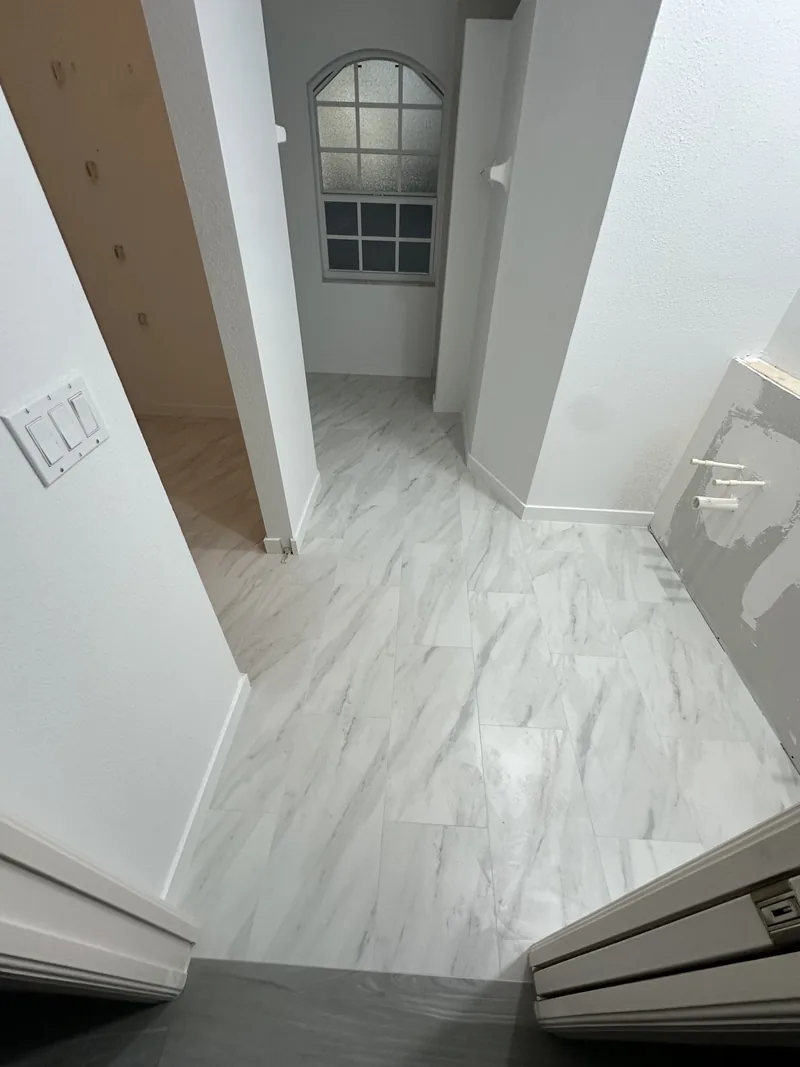 Marble-look porcelain tile flooring installation in Sarasota FL